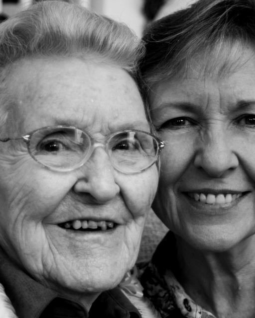 Two women, one elderly, photographed close together in black and white
